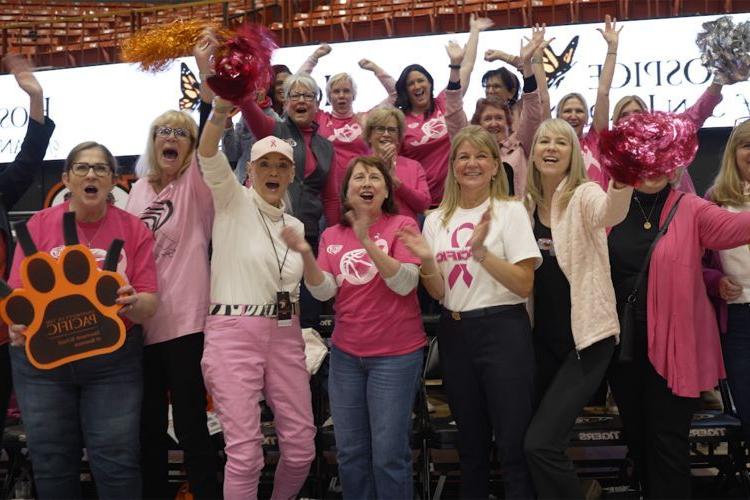 First Lady Jean Callahan with other women leaders at a women's basketball game. 